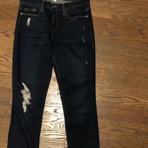 FRAME skinny jeans w/ distressed knee and fray hem